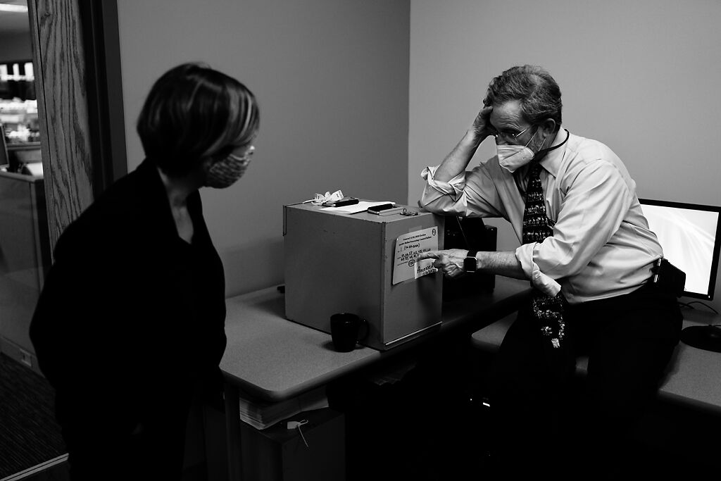 Boone County Clerk Brianna Lennon, left, and her Director of Elections, Art Auer, discuss processing absentee ballots and confirming absentee totals